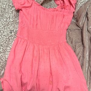 Pink small polkadots on it dress